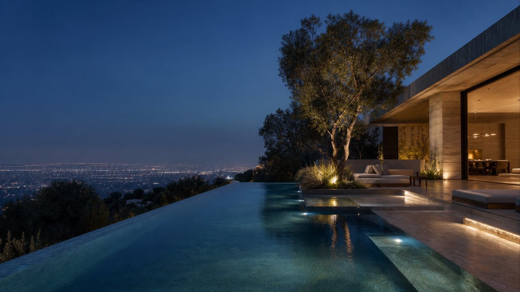 Infinity pool overlooking Los Angeles at blue hour